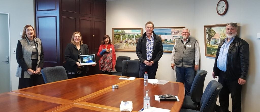 Board room with people around a table