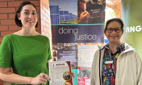 Two women at event stalls