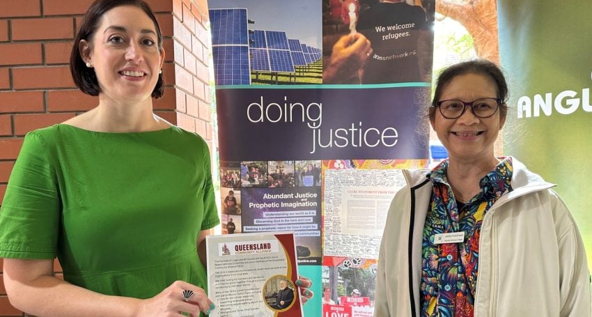 Two women at event stalls
